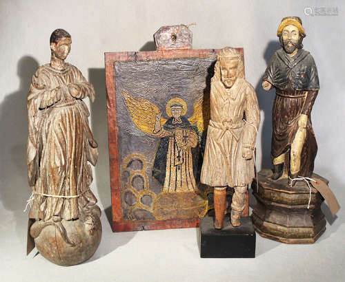 A group of three Philippines carved wood figures of saints,