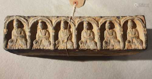 A Chinese grey pottery rectangular brick with an arcade of six Buddhas, in Tang Dynasty style