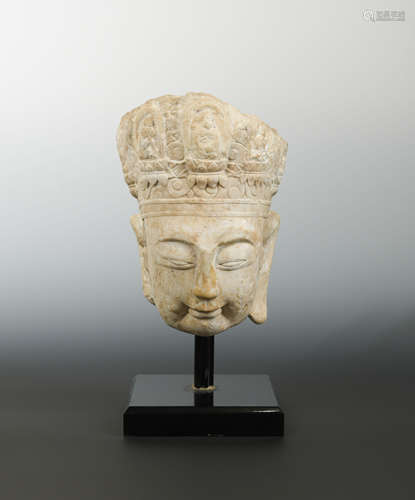 A Chinese limestone head of Avalokiteshvara, perhaps Sui Dynasty (581-618 AD),