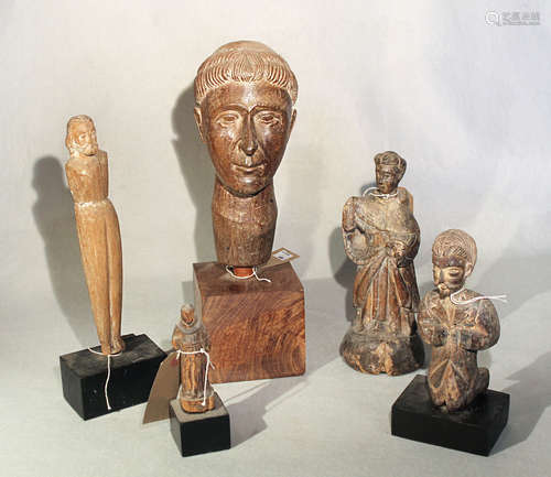 A group of five Philippines carved wood figures and heads of saints, 19/20th century