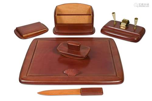 A good quality Italian six-piece cognac leather desk set,