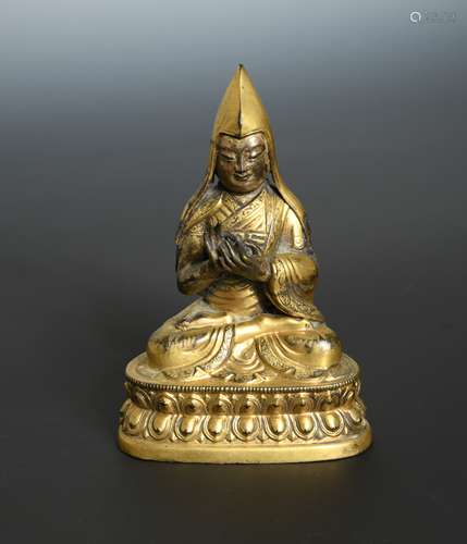 A Tibetan gilt bronze figure of the High Lama Tsongkapa, 19th century,