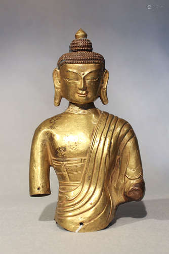 A Nepalese gilt-copper repousse upper torso of a Buddha, 18th century,