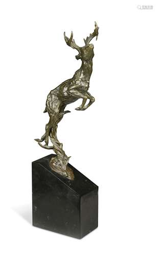 A contemporary bronze model of a leaping stag,