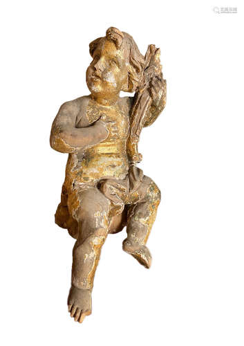 A carved gilt model putto,