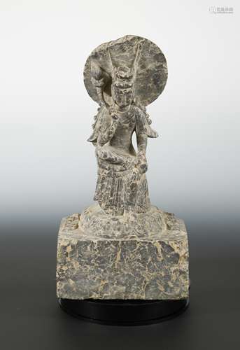 A Chinese mottled marble seated meditating Guanyin, in Wei Dynasty style,