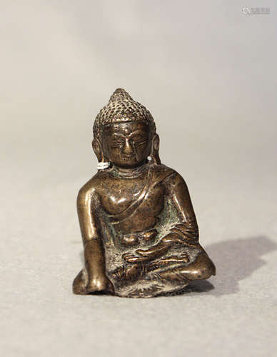 A Tibetan bronze fragmentary small Buddha, seated in meditation, 16th century or later,