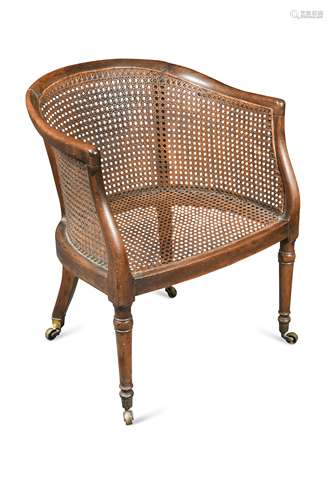 A Regency mahogany caned library bergere tub chair,