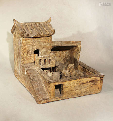 A Chinese unglazed grey pottery model of a farmyard, probably Eastern Han Dynasty,