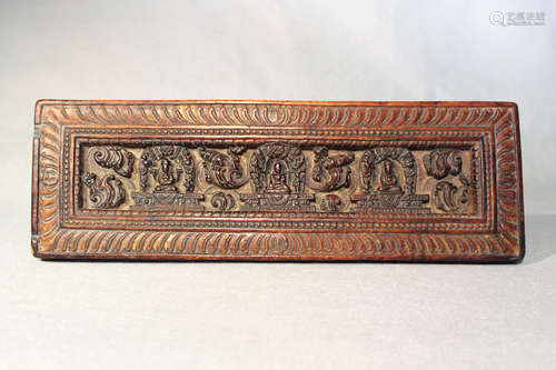 A Tibetan carved wood manuscript cover, 14th/15th century or later,