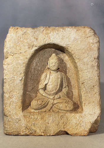 A Chinese cream stone figure of a seated Buddha in a niche, in 5-6th century style,