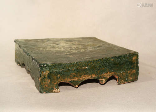 A Chinese green glazed pottery square stand, cusped apron, Han Dynasty,