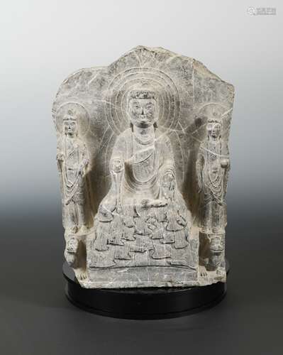 A Chinese grey veined stone Buddhist triad group, also on reverse, in Eastern Wei style,