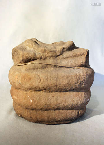 A Chinese/Cambodia sandstone fragmentary figure of a seated Buddha, perhaps 10/11th century,