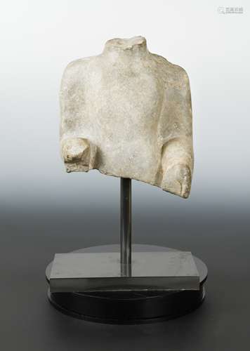 A Chinese grey limestone upper body fragment of a standing Buddha, in Wei Dynasty style,