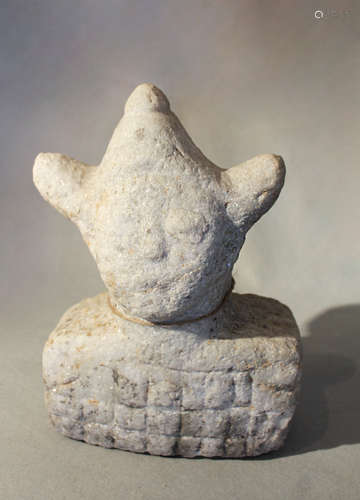 A Chinese crystalline white stone stylised head with tricorn headgear,