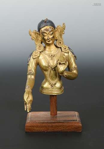 A Tibetan gilt-bronze tara torso fragment, 19th century,