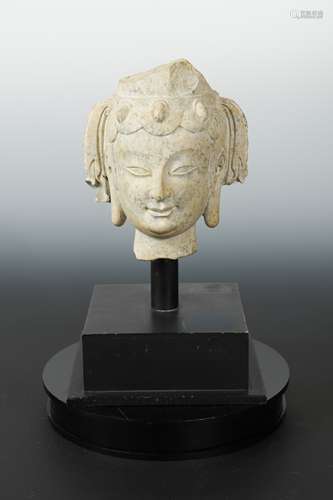 A Chinese pale stone head fragment of a Bodhisattva, perhaps Sui Dynasty,