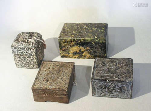 A group of three Chinese decorative stone boxes and a relief carved block,