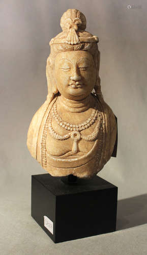 A Chinese white crystalline marble upper body and head of the Bodhisattva Guanyin, in Tang style,