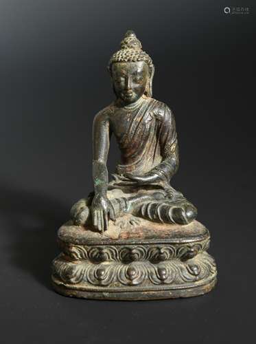 A Nepalese bronze seated figure of a Buddha, possibly 15th/16th century,