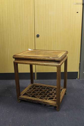 A Chinese hardwood low table/stand, with deeply moulded apron