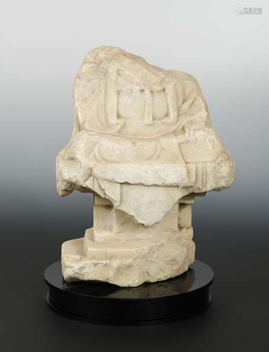 A Chinese white marble fragmentary Buddhist deity on pedestal, in Northern Qi style,