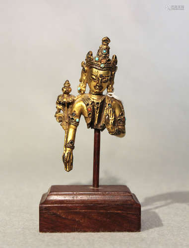 A Tibetan gilt bronze Bodhisattva fragment, 14th/15th century,