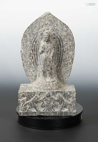 A Chinese carved stone standing figure of Avalokiteshvara with aureole, in Wei Dynasty style,