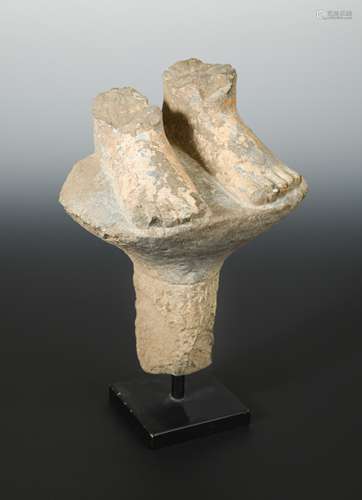 A Chinese grey limestone fragment carving of the feet of a Buddhist deity, perhaps Wei/Qi Dynasty,