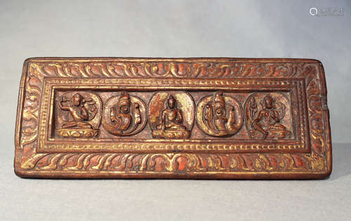 A Tibetan carved and parcel gilt-wood manuscript cover, 14th/15th century or later,