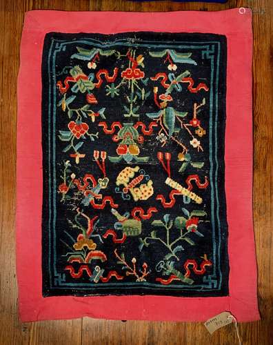 A Tibetan woollen small rug, circa 1900-1920