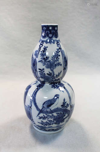 A Chinese blue and white double gourd vase,