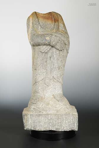 A Chinese grey stone standing Buddhist deity, headless, in 6/7th century style,