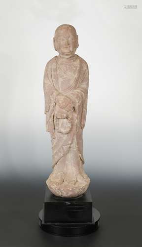 A Chinese red sandstone standing arhat, in Tang Dynasty style,