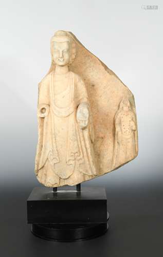 A Chinese white marble Buddhist triad stele fragment, in late Wei Dynasty style,