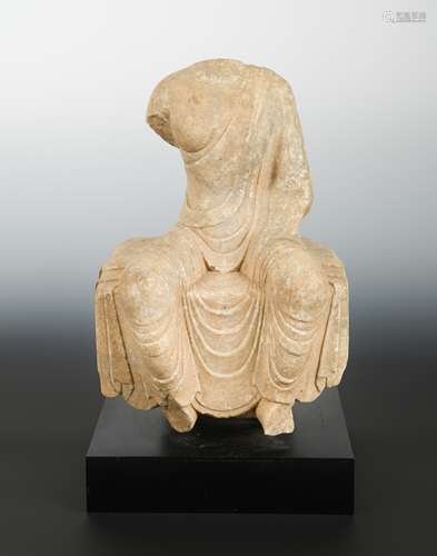 A Chinese white marble seated Buddhist deity, torso only, Wei Dynasty style,