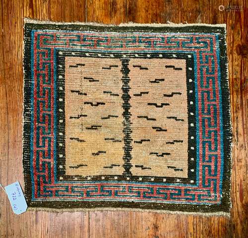 A Tibetan wool tiger stripe single seat meditation rug, 19th century