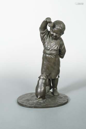 A Japanese bronze group of a boy teasing a puppy dog with a biscuit, Late Meiji Period (1868-1912),