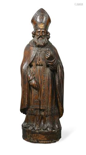 A carved softwood figure of a bishop, 17th century,