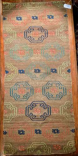 A Tibetan wool rug, circa 1900-1930