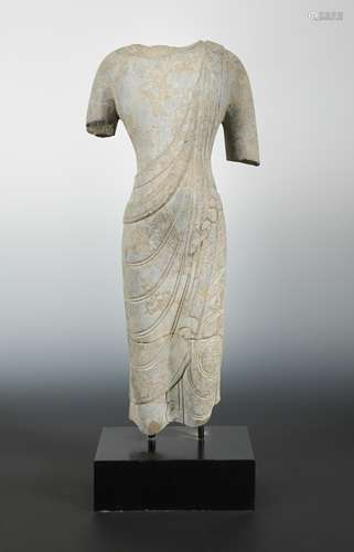 A Chinese limestone fragmentary torso of a Buddha, in Wei Dynasty style,