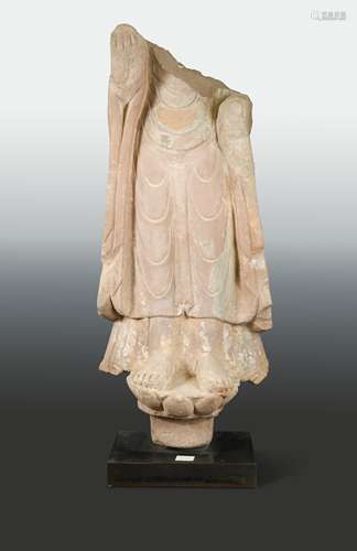 A Chinese red sandstone lower enrobed torso of standing Buddha, Northern Wei Dynasty style