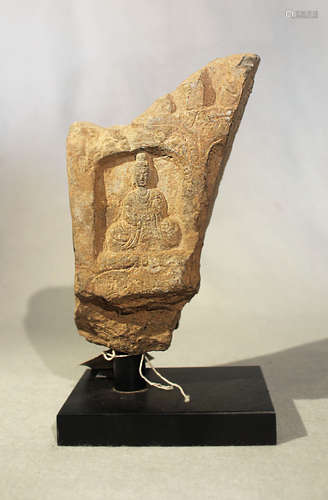 A Chinese grey stone stele fragment with Buddhist deities in relief, in Wei Dynasty style,