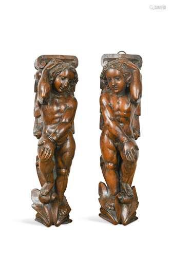 A pair of carved walnut wall brackets, probably 19th century,