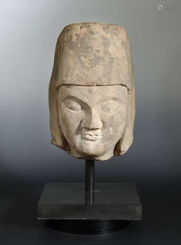 A Chinese cream stone male head, with headdress, perhaps Tang,