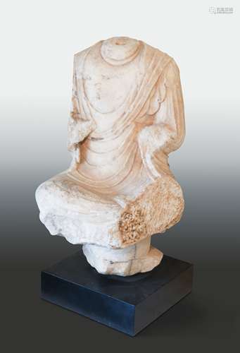 A Chinese white marble seated Buddha on a pedestal, headless, Northern Wei style,