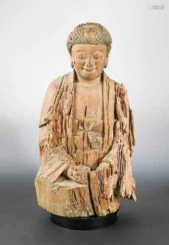 A Chinese carved and polychrome wood seated figure of Sakyamuni Buddha, in Jin style,