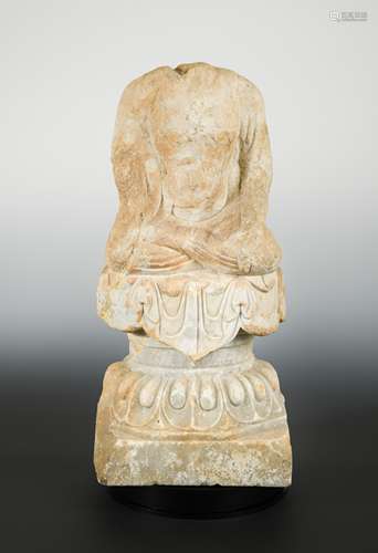 A Chinese pale stone seated Buddha on pedestal, headless, perhaps northern Qi,