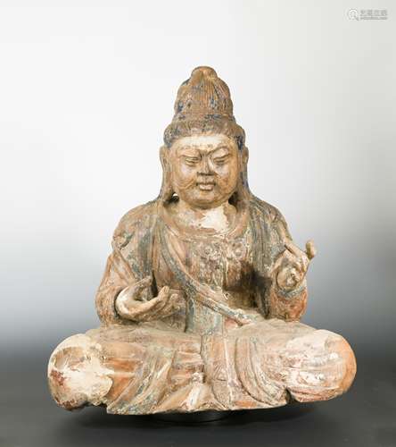 A Chinese carved and polychrome wood seated figure of Maitreya, with elaborate chignon,